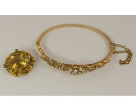A 15ct Edwardian pearl set floral bangle diameter approx 57mm, together with a citrine brooch in a yellow metal filigree moun