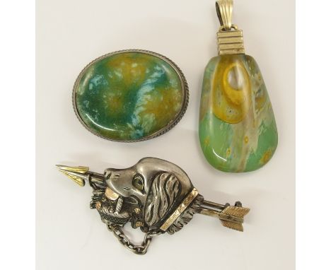 A white and yellow metal dog brooch the dog is carrying a basket of flowers in his mouth, together with a Charles Horner cera