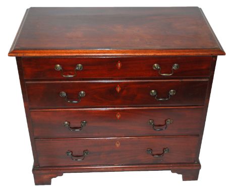 A mahogany and crossbanded chest with four graduating drawers, bail handles and on bracket feet, 76cm high x 84cm wide x 44cm