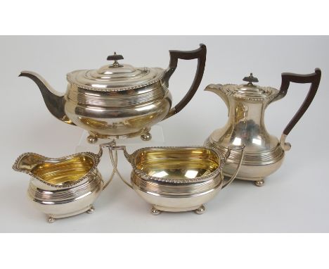 A four piece silver tea service by James Dixon & Sons Limited, Sheffield 1929, (the teapot 1930), of rounded rectangular form