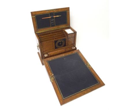 A Victorian stained oak stationery box and writing slope the hinged top and front revealing fitted interior with white-metal 