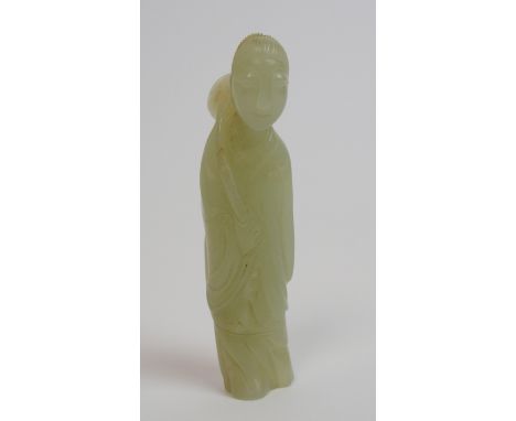 A Chinese jade carving of lady standing and holding a large lotus over her shoulder, 7.5cm high