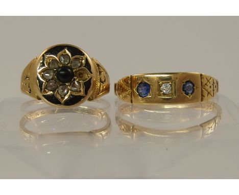 A 15ct rose cut diamond and black enamel ring set with a onyx gem to the centre, engraved 1883 to the inner shank finger size
