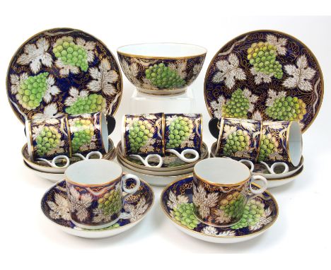 A 19th Century Spode pottery grape and leaf coffee set gilded vine leaf with bunches of green grapes on a cobalt blue ground,