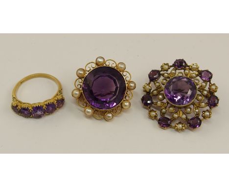 A collection of vintage amethyst jewels to include a 15ct brooch with a large central dark purple amethyst further set with p
