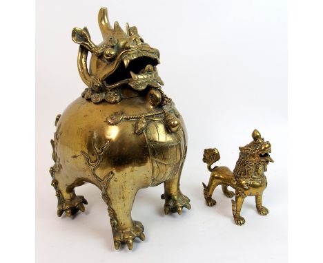 A Chinese brass Kylin censer the animal on all fours with hinged detachable head, 29cm high and a smaller model, 14cm high (2