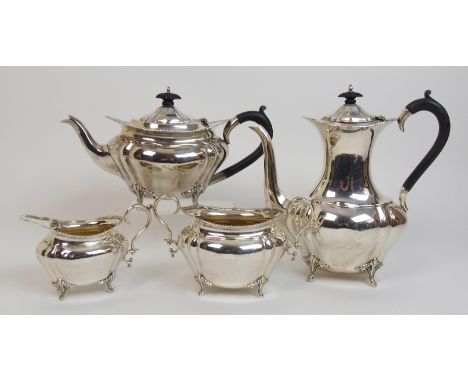 A four piece silver tea service by Mappin & Webb, Sheffield 1919, of oval form with lobed body and gadrooned border on four o