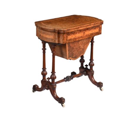 A VICTORIAN WALNUT COMBINED GAMES AND WORK TABLECIRCA 1870The hinged top enclosing an inlaid chess board, cribbage board, and