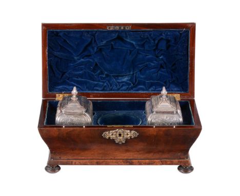 A GEORGE III MAHOGANY TEA CADDYCIRCA 1770Of bombe outline, the lid enclosing a velvet interior with a pair of silver plated c