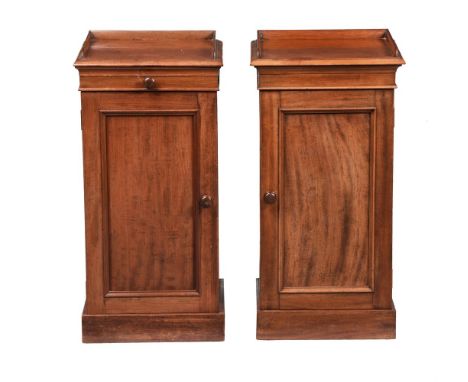 A PAIR OF VICTORIAN MAHOGANY BEDSIDE PEDESTAL CUPBOARDSCIRCA 1870Each 77cm high, 38cm wide, 38cm deepProvenance: Property rem