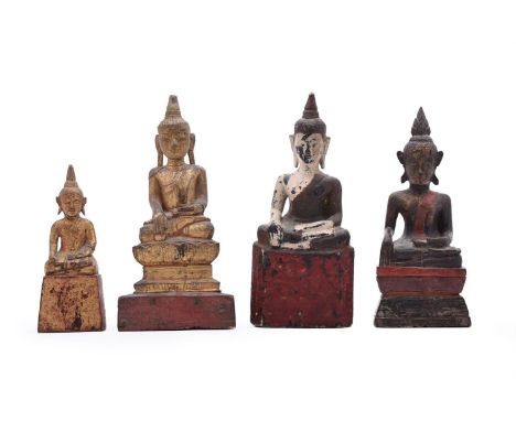 FOUR THAI GILT-WOOD SEATED FIGURES OF BUDDHALATE 19TH OR 20TH CENTURY variously painted and gilt, between 24cm and 16.5cm hig