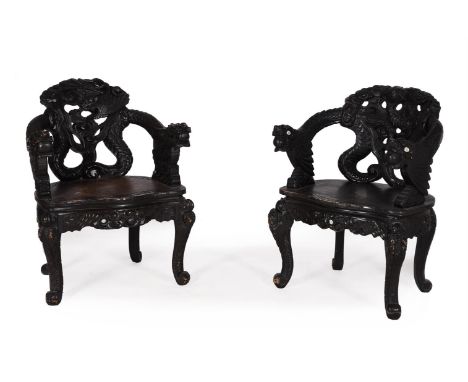 A PAIR OF CHINESE CARVED HARDWOOD CHAIRSEARLY 20TH CENTURYWith dragon handles and scroll legs83cm high