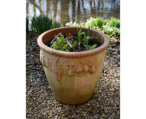 A MODERN TERRACOTTA GARDEN PLANTERWith moulded bands of fruits to the sides62cm high, 66cm diameterCondition Report: Overall 