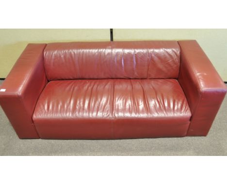 A three seat sofa, upholstered in claret coloured fabric, 170cm wide x 79cm deep