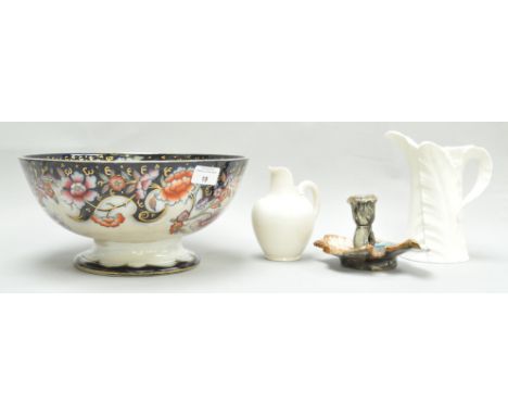 Two Royal Worcester jugs, the largest 17cm high, together with a large 19th century bowl and a Majolica chamberstick