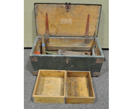 A wooden chest and some tools