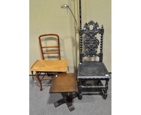 An ebonised hall chair with elaborately carved foliate back, 115cm high, together with a low occasional table, a Victorian ch