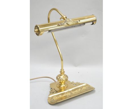 A banker's brass  lamp, 39cm high, with pen tray and cylindrical shade