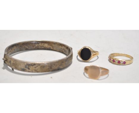 A bangle and three rings