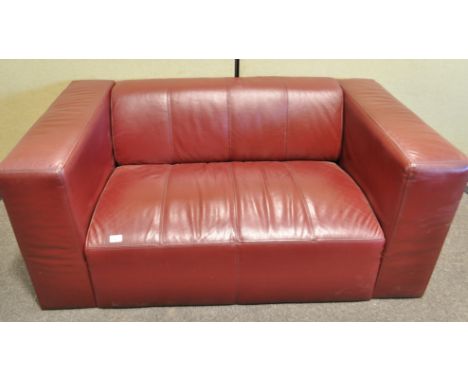 A two seat sofa, upholstered in claret coloured fabric, 136.3cm wide x 81cm deep