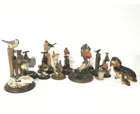 A collection of Country Artist resin birds and ceramic dogs including a Dresden dog