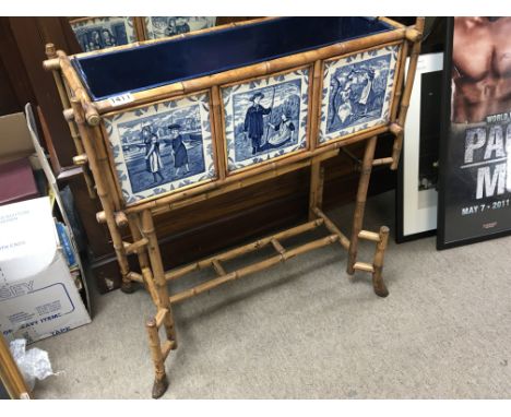 An Victorian Aesthetic movement bamboo and Wedgwood ceramic plaque flower jardiniere. the design for these plaques first regi