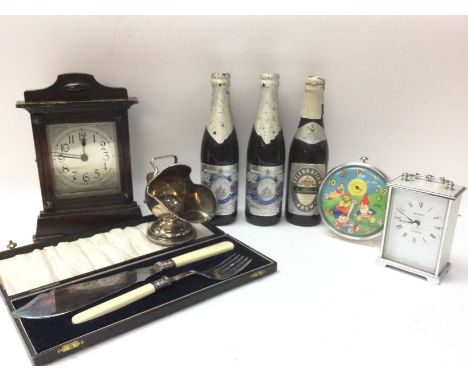 Am assorted lot consisting of a mahogany bracket alarm clock, working Metamec clock, unopened commemorative prince of Wales &