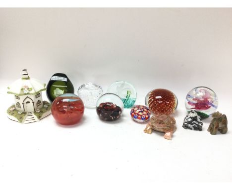 A collection of vintage glass and stone paperweights including a limited edition flower green paperweight &amp; a Coalport pa