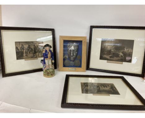 A collection of Lord Nelson ornaments including a ceramic Toby jug, a display case with Nelson associated medals and framed i