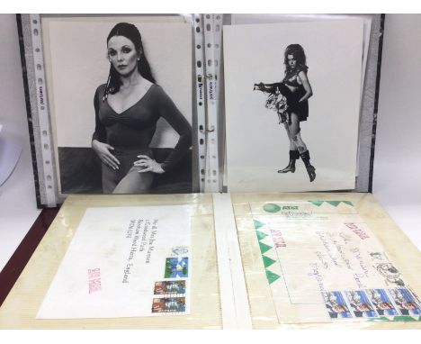 A binder of first day covers and a binder of vintage film star publicity prints.