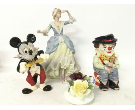A collection of ceramic figures, Wedgewood Little Bo-Peep, Crystal Arts Swarovski Mickey Mouse figure, Doulton Clown characte