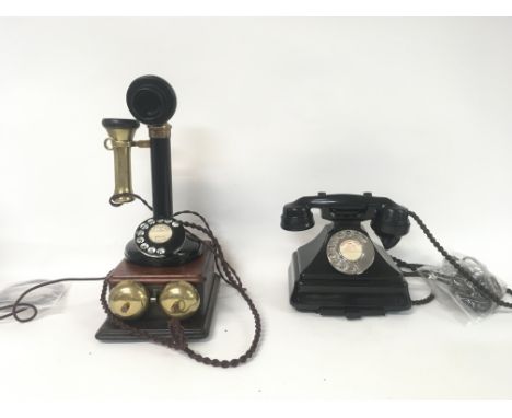 A black enamel and brass vintage telephones