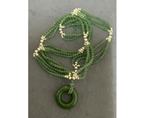 A jade and Pearl necklace.