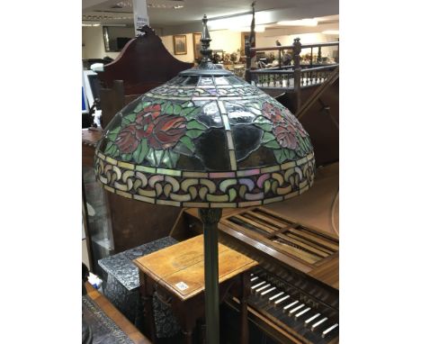 A Tiffany style lead light and metal standard lamp.