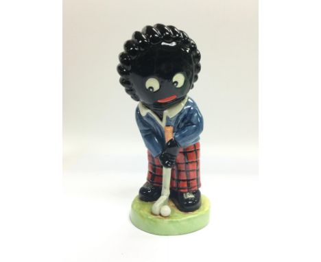 A limited edition Carltonware figure of a Golly golfer, 21/50, approx height 21cm.