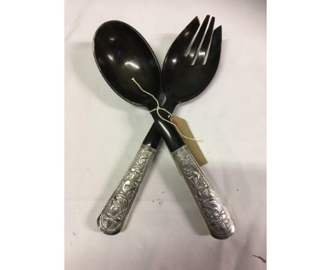  Sale Item:    INDIAN SILVER HANDLED SALAD SERVERS  Vat Status:   No Vat   Buyers Premium:  This lot is subject to a Buyers P