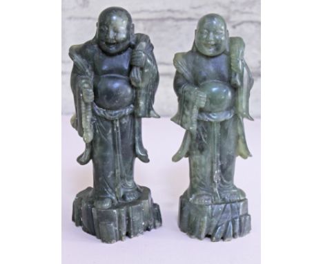 A pair of Chinese carved jade figures, height 24.5cm.  CONDITION REPORT - minor chips and nibbles throughout.