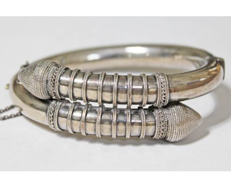 A Victorian white metal bangle, diam. approx. 6.5cm, wt. 48.2g, originally belonging to Constance Demain Saunders (see lot 30