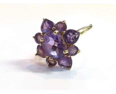 An amethyst flower ring stamped 14k, size K, 3.6g