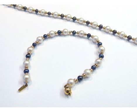 A pearl necklace and bracelet set, clasp stamped 9ct 