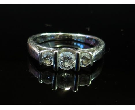 A white gold three stone diamond ring stamped 18k, size K, 3.6g