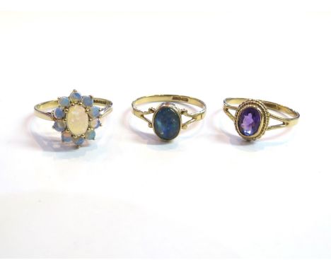 Three 9ct gold rings including amethyst and opal, 5.3g