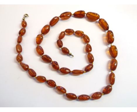 A cognac amber bead necklace, from the amber shop Southwold in original pouch and box, 30g