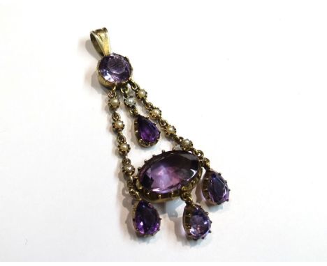 A Victorian amethyst and seed pearl pendant with four amethyst drops and large amethyst stone, 5.5cm drop, 5.8g