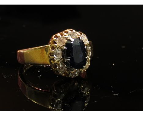 An 18ct gold sapphire and diamond cluster ring, size M/N, 7.4g