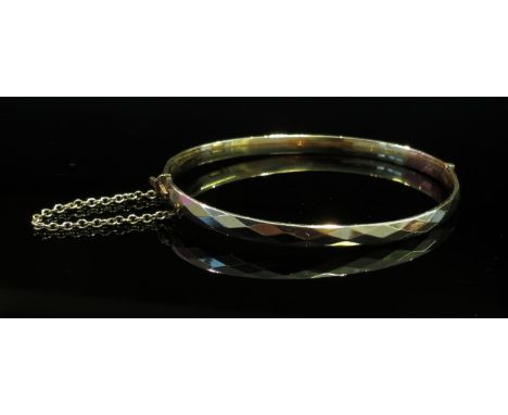 A 9ct gold plated stiff hinge bangle 