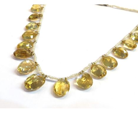 A seed pearl neck chain hung with seventeen graduated oval citrines with gold clasp, 