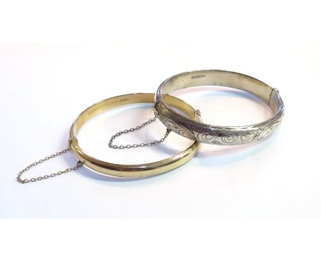 A silver bangle and a 9ct gold bangle, 8.6g 9ct gold (2)