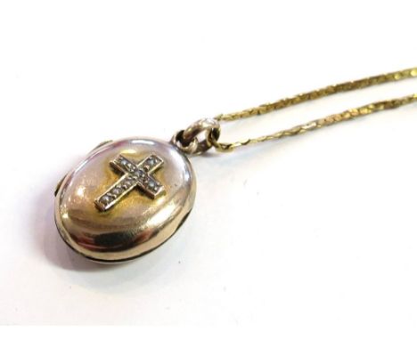 A 9ct gold chain hung with oval locket with pearl set cross to front, 3.7g