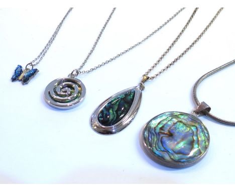 Four abalone shell pendants, one in the form of a butterfly and an abalone shell bangle